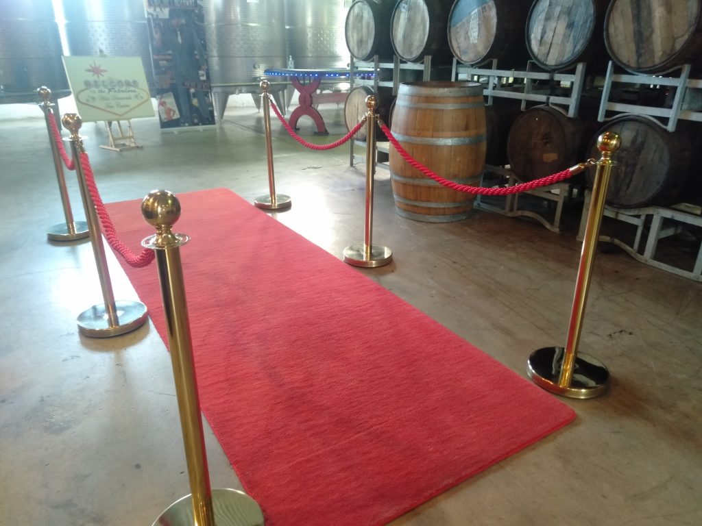 Luxury red carpet entrance with gold stanchions for Wild Diamonds Fun Casino events in Brisbane and Sunshine Coast - Premium casino party entertainment with VIP treatment