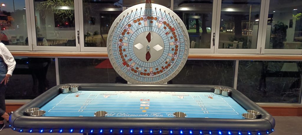 Money Wheel casino game by Wild Diamonds Fun Casino Brisbane - Large spinning wheel and professional casino table for Sunshine Coast and Brisbane event entertainment