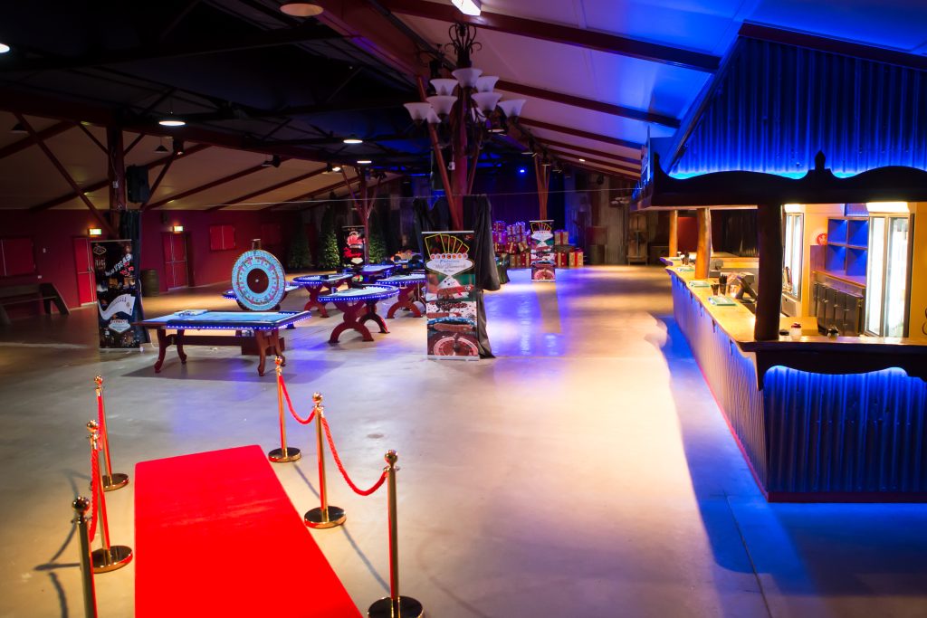 Complete casino event setup by Wild Diamonds Fun Casino Brisbane - Professional casino gaming tables with red carpet entrance and luxury lighting for Sunshine Coast and Brisbane corporate events and parties