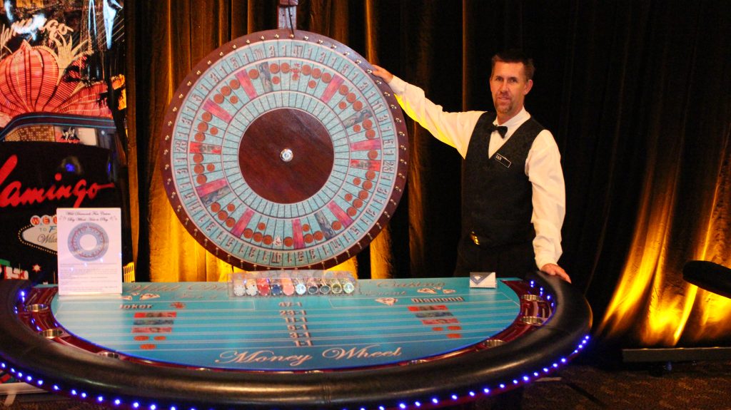 Professional casino dealer with Money Wheel at Wild Diamonds Fun Casino Brisbane event - Expert casino entertainment service for Sunshine Coast and Brisbane venues